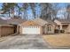 Charming brick home with a well-maintained front yard and a two-car garage at 4203 Jordans Bank, Union City, GA 30291