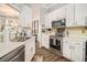 Well-lit kitchen featuring stainless steel appliances and white cabinetry at 4203 Jordans Bank, Union City, GA 30291