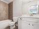 Bathroom with white vanity, tiled shower, modern fixtures and a large mirror at 549 Henry Dr, Marietta, GA 30064