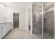 Modern bathroom featuring a glass-enclosed shower and vanity with storage at 549 Henry Dr, Marietta, GA 30064