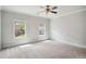 Bright, neutral bedroom with two windows allowing ample natural light at 549 Henry Dr, Marietta, GA 30064