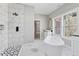 Elegant bathroom featuring a soaking tub, walk-in shower, and modern fixtures at 1081 Napier Se St, Atlanta, GA 30316