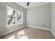 This bedroom boasts neutral colors, light hardwood floors, and lots of natural light through two windows at 1081 Napier Se St, Atlanta, GA 30316