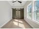 This bedroom features natural light, a ceiling fan, and closet with sliding barn doors at 1081 Napier Se St, Atlanta, GA 30316