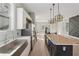 Contemporary kitchen featuring a spacious island, stainless steel appliances, and modern lighting fixtures at 1081 Napier Se St, Atlanta, GA 30316