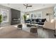 Stylishly staged living room with gray tones, a cozy fireplace, natural lighting, and elegant decor at 1081 Napier Se St, Atlanta, GA 30316