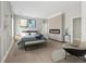 Cozy main bedroom featuring fireplace, neutral walls and decor, and ample natural light at 1081 Napier Se St, Atlanta, GA 30316