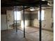 Unfinished basement with exposed pipes and ductwork, windows, and a concrete floor at 3387 Forest Hill Rd, Powder Springs, GA 30127