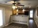 Open kitchen with breakfast bar, stainless appliances, and easy access to the patio at 3387 Forest Hill Rd, Powder Springs, GA 30127