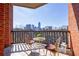 Balcony with city skyline views and comfortable seating area at 395 Central Park Ne Pl # 420, Atlanta, GA 30312