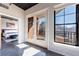 Bedroom doorway leading to sunny balcony with a view, bright windows, and stylish design at 395 Central Park Ne Pl # 420, Atlanta, GA 30312