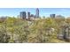 City view, with the cityscape behind mature trees at 395 Central Park Ne Pl # 420, Atlanta, GA 30312