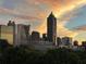 Stunning sunset view of the city skyline with a blend of urban and natural beauty at 395 Central Park Ne Pl # 420, Atlanta, GA 30312