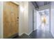 Hallway with polished concrete floors, apartment entry door and access to interior spaces at 395 Central Park Ne Pl # 420, Atlanta, GA 30312