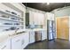 Well-lit kitchen with stainless steel appliances, white cabinets, and concrete floors at 395 Central Park Ne Pl # 420, Atlanta, GA 30312