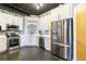 Modern kitchen featuring stainless steel appliances, white cabinets, and concrete floors at 395 Central Park Ne Pl # 420, Atlanta, GA 30312