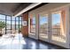 Bright living room with large windows, exposed brick, and balcony access offering city views at 395 Central Park Ne Pl # 420, Atlanta, GA 30312