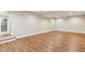 Finished basement with vinyl plank flooring, recessed lighting and neutral paint at 645 Trailmore Pl, Roswell, GA 30076