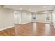 Finished basement with wood flooring, recessed lighting, and bright windows at 645 Trailmore Pl, Roswell, GA 30076