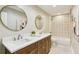 Modern bathroom with double vanity, granite countertops, and tiled shower and tub at 645 Trailmore Pl, Roswell, GA 30076