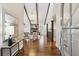 Bright and airy living room featuring vaulted ceilings, hardwood floors, fireplace and modern decor at 645 Trailmore Pl, Roswell, GA 30076