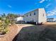 View of the home's backyard with green grass and new landscaping at 7722 Sudbury Cir, Covington, GA 30014