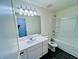 Clean bathroom features a vanity with a sink and a shower-tub combo at 7722 Sudbury Cir, Covington, GA 30014