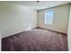 Bright bedroom with a neutral color palette and a large window for natural light at 7722 Sudbury Cir, Covington, GA 30014