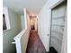 Bright hallway with laundry access, and a storage closet at 7722 Sudbury Cir, Covington, GA 30014