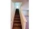 Carpeted staircase leading to the upper level of the home at 7722 Sudbury Cir, Covington, GA 30014