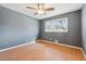 Bedroom with a window has wood floors and a ceiling fan at 401 Cabriolet Ct, Mcdonough, GA 30253