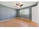 Comfortable bedroom featuring hardwood floors, a ceiling fan, and a window for natural light at 401 Cabriolet Ct, Mcdonough, GA 30253