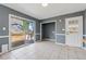 Sun room featuring sliding glass doors, light grey walls, and access to the backyard at 401 Cabriolet Ct, Mcdonough, GA 30253