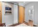 Stylish bathroom area featuring a sliding wood door and an adjacent all-white full bathroom with a shower at 964 Dekalb Ne Ave # 112, Atlanta, GA 30307