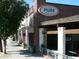 Exterior view of Pure Taqueria on the street; brick building with patio at 964 Dekalb Ne Ave # 112, Atlanta, GA 30307