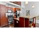 Open kitchen with island, stainless steel appliances, and modern cabinetry at 964 Dekalb Ne Ave # 112, Atlanta, GA 30307