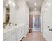 Bathroom featuring white cabinetry, double sinks, a large mirror, and a glass-enclosed shower at 2030 Main Nw St # 205, Atlanta, GA 30318