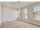 Bedroom with neutral tones features two large windows providing plenty of natural light at 2030 Main Nw St # 205, Atlanta, GA 30318