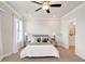 Bright bedroom features a ceiling fan, a window for natural light, and an ensuite bathroom at 2030 Main Nw St # 205, Atlanta, GA 30318