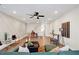 Bright living room showcasing a modern ceiling fan and stylish decor, plus attractive accent wall details at 2030 Main Nw St # 205, Atlanta, GA 30318