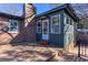 Wooden back deck with a seating area, brick chimney, an extension for entertaining, and enjoying outdoor living at 510 Debra Dr, Marietta, GA 30066