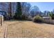 Expansive backyard with a combination of grassy and pine straw areas, providing a natural setting for outdoor activities at 510 Debra Dr, Marietta, GA 30066