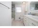 Bathroom with tiled shower and updated vanity with granite countertop and modern fixtures at 510 Debra Dr, Marietta, GA 30066