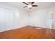 Bright bedroom featuring hardwood floors, a ceiling fan, and closet at 510 Debra Dr, Marietta, GA 30066