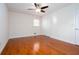 Bright bedroom with a ceiling fan, hardwood floors, and a closet at 510 Debra Dr, Marietta, GA 30066