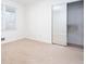 Bedroom with standard closet, light beige carpet and large window with blinds for natural light at 510 Debra Dr, Marietta, GA 30066