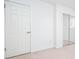 Bedroom with a closet with mirrored doors, light beige carpet, and standard closet door at 510 Debra Dr, Marietta, GA 30066