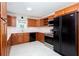 Kitchen featuring wooden cabinets, stainless steel appliances, and a skylight at 510 Debra Dr, Marietta, GA 30066