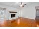 Bright living room with a whitewashed brick fireplace and hardwood floors at 510 Debra Dr, Marietta, GA 30066