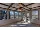 Bright sunroom with wood-framed ceiling, ceiling fan, many windows and light-colored wood flooring at 510 Debra Dr, Marietta, GA 30066